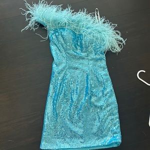Blue sequin hoco/ cocktail dress. One shoulder and feathers. Has padding in bra